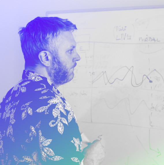 DUX agency founder Kristian Lember in front of a whiteboard
