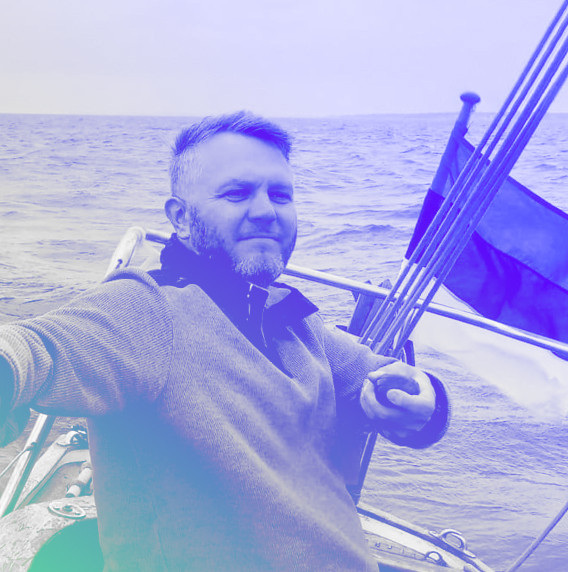 DUX partner and designer Kristian Lember on a sailboat